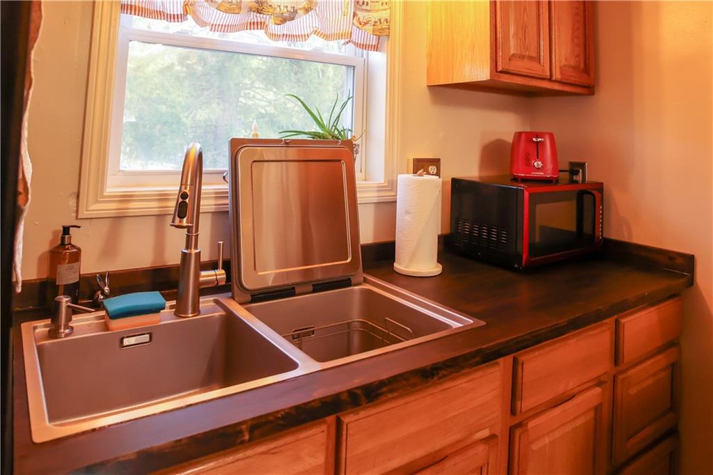 1021 Leesburg Station Road Mercer, PA 16137 - Photo 10 of 45 a room with water heater and wooden cabinets