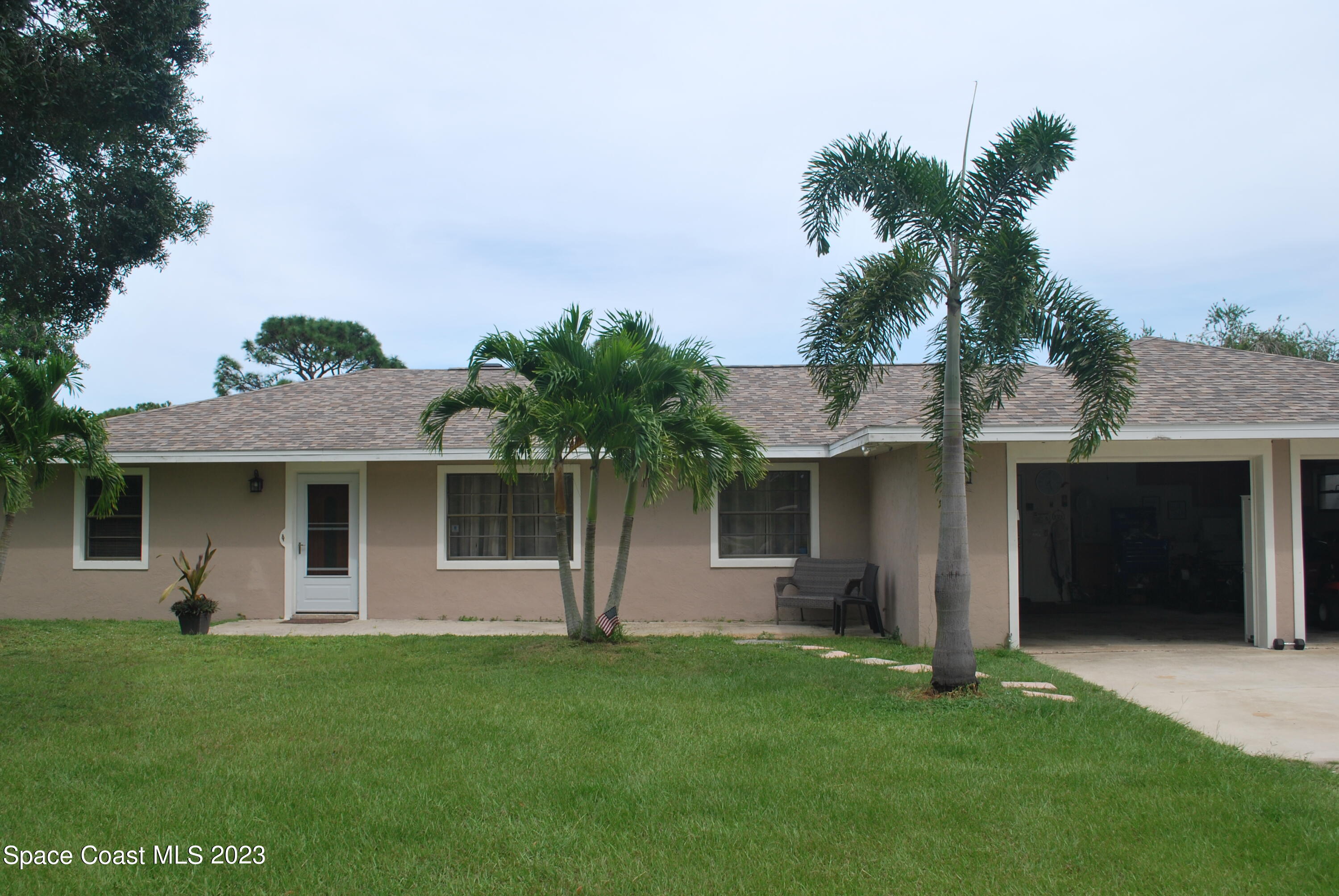2745 Corey Road Malabar, FL 32950 - Photo 22 of 39 a front view of house with yard and green space