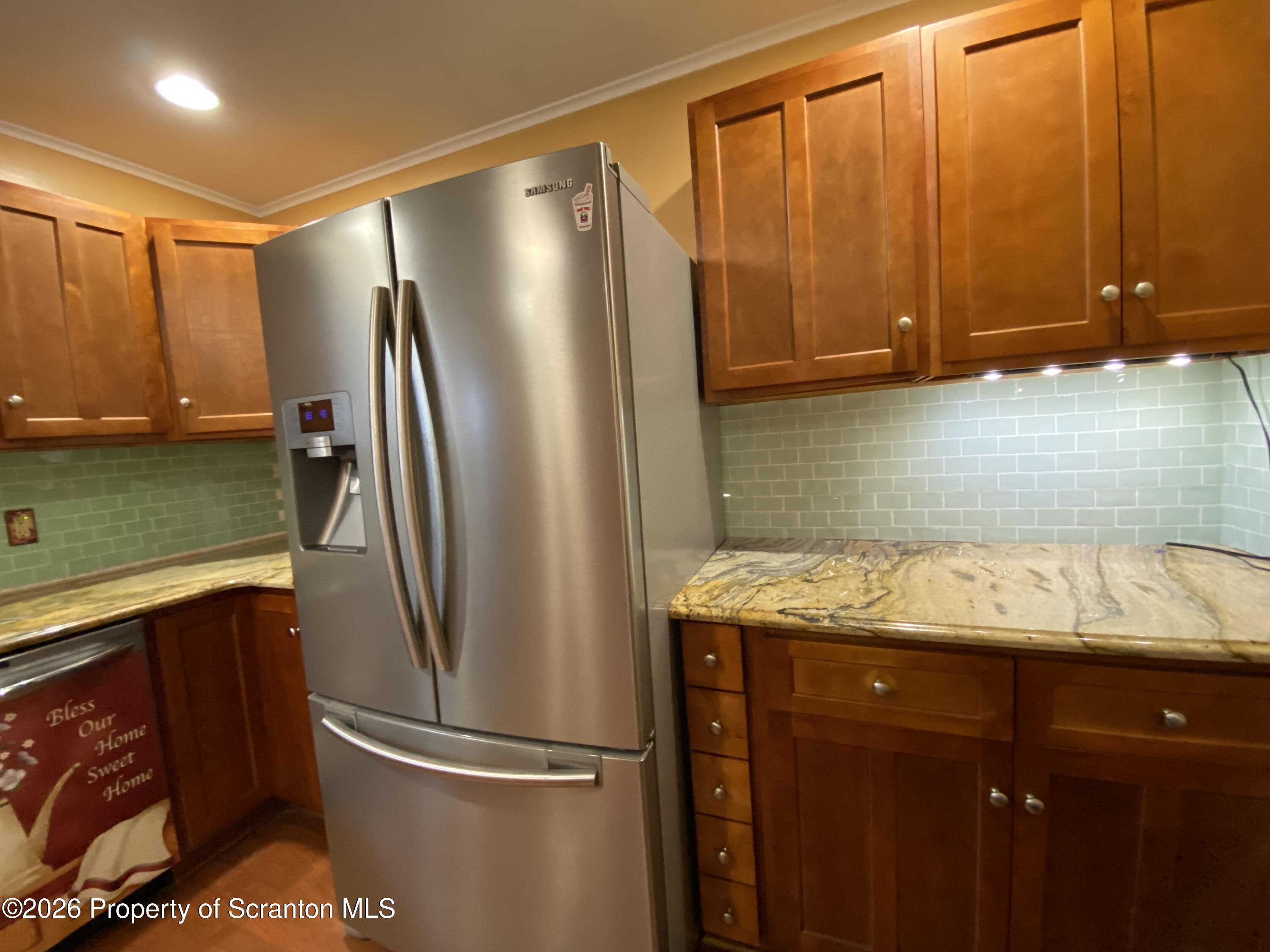 1019 Moosic Street Scranton, PA 18505 - Photo 14 of 43 a kitchen with stainless steel appliances granite countertop a refrigerator and a sink