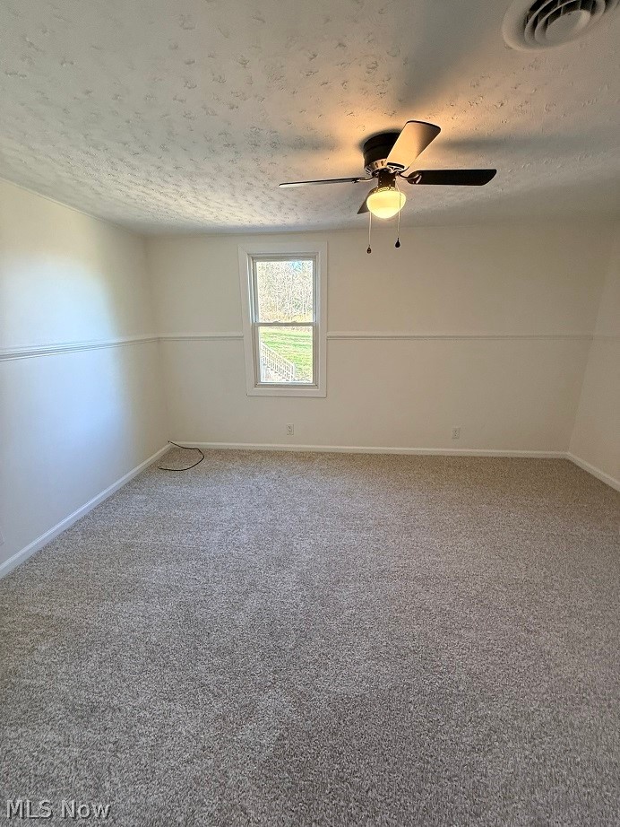 144 Aberdeen Road Steubenville, OH 43953 - Photo 23 of 34 Carpeted empty room featuring a textured ceiling and a ceiling fan