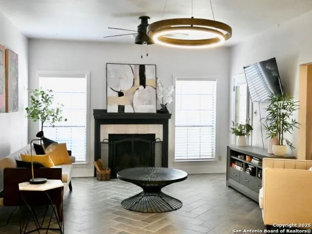a dining room with furniture and wooden floor