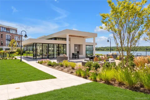 a view of a house with a yard patio and swimming pool