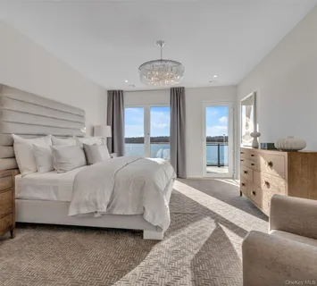 a bathroom with a tub sink shower and mirror