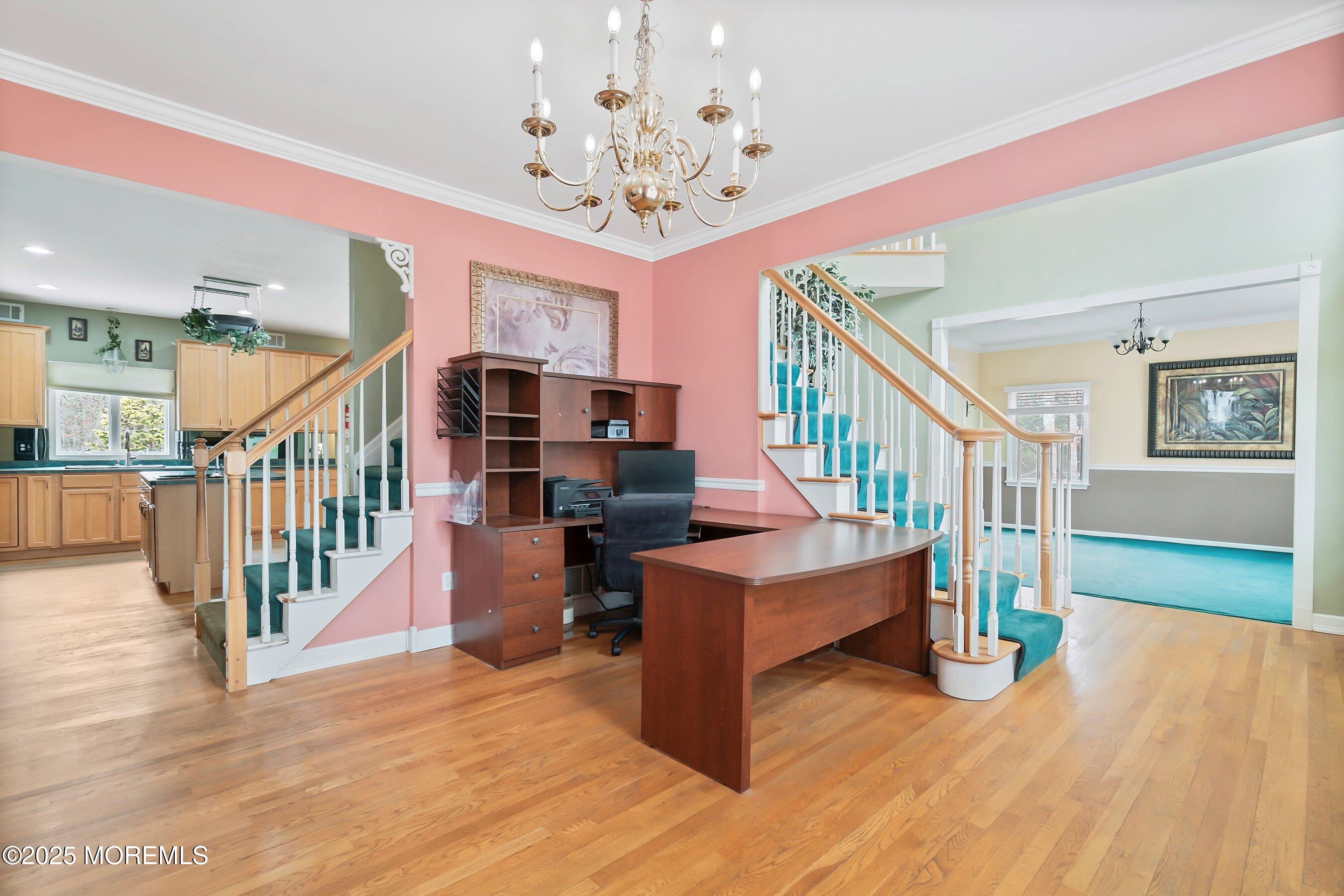 9 Ranch Boulevard Manahawkin, NJ 08050 - Photo 16 of 55 a view of entryway dining room and hall with wooden floor