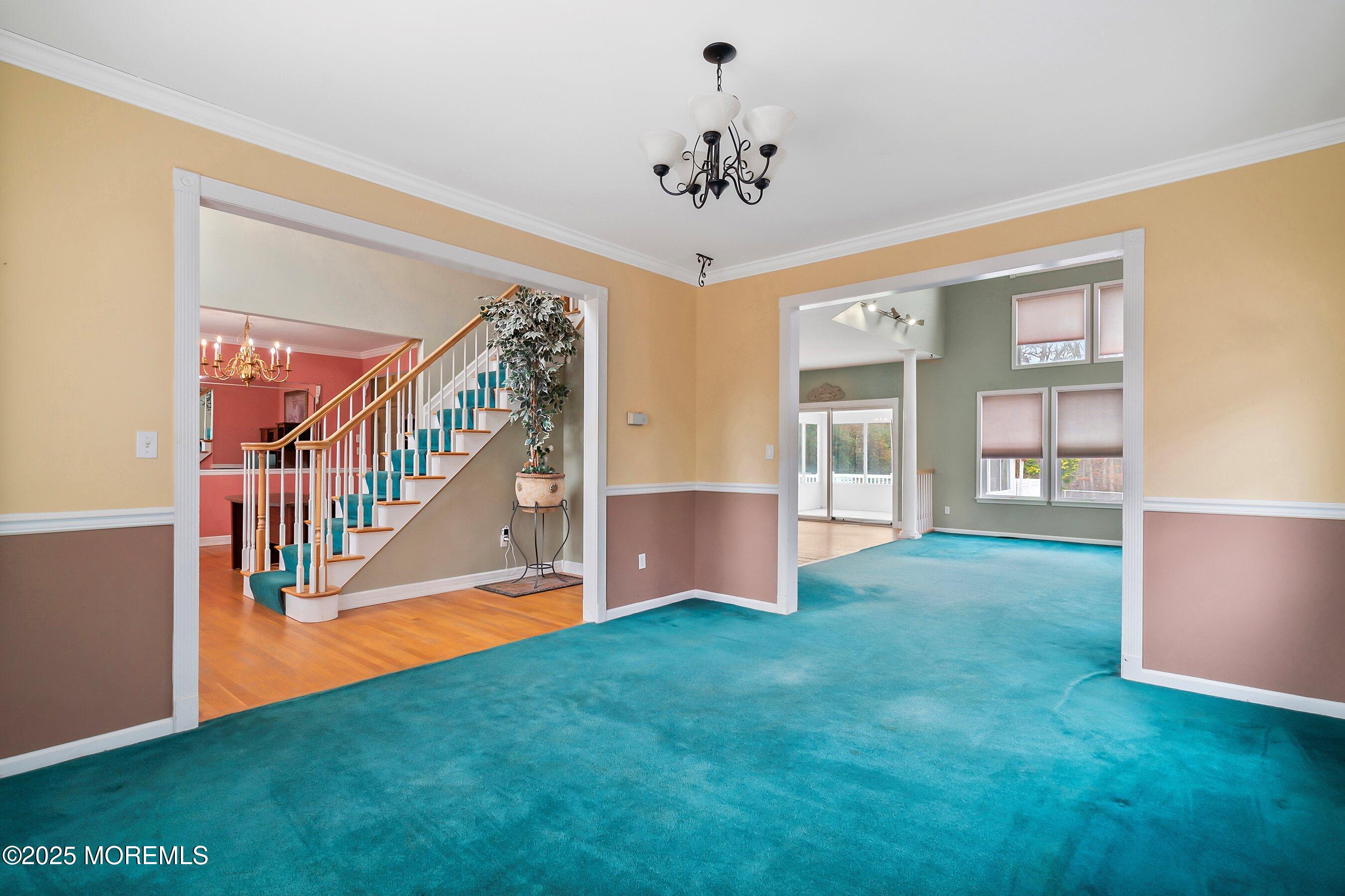 9 Ranch Boulevard Manahawkin, NJ 08050 - Photo 19 of 55 a view of an room with staircase and wooden floor