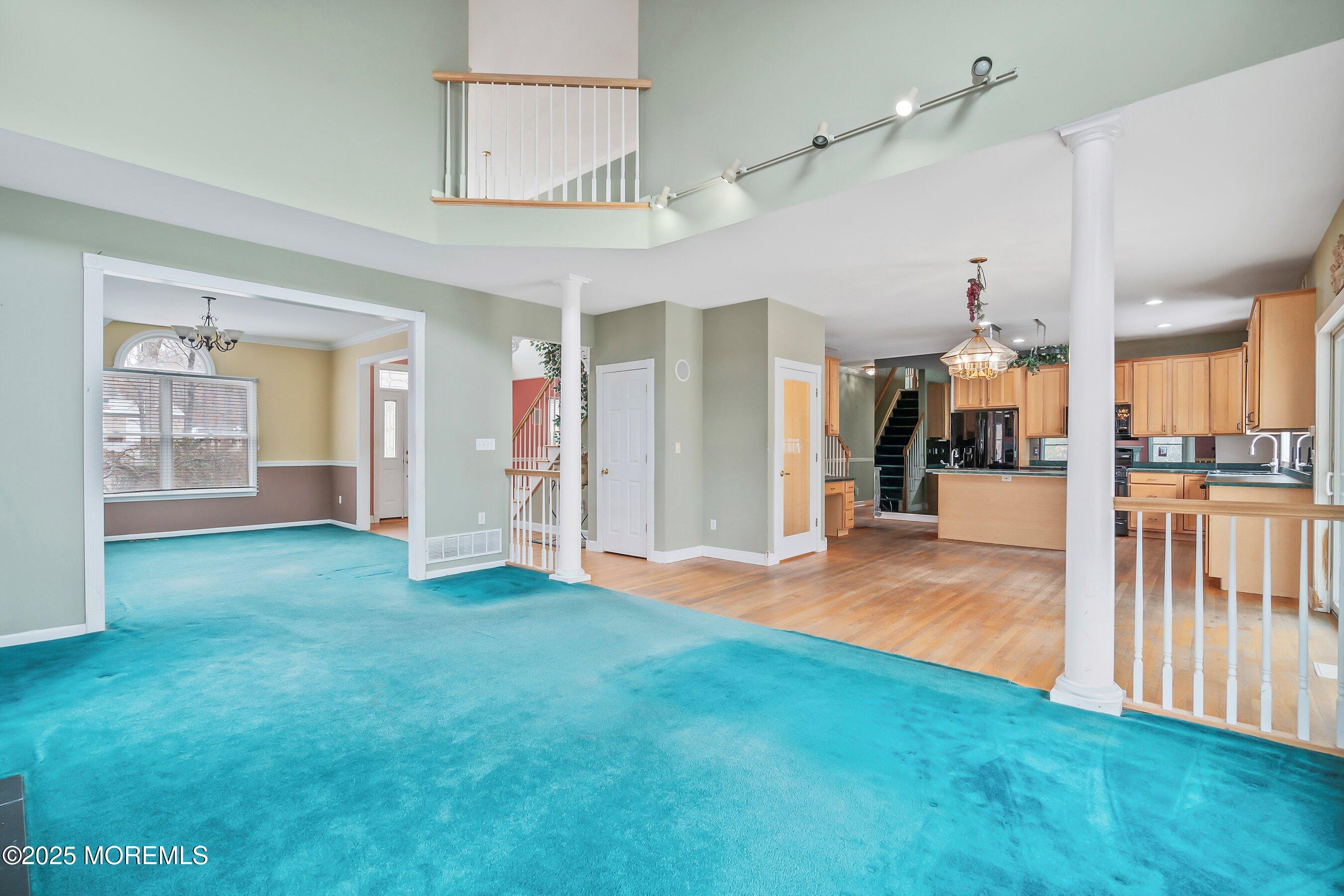 9 Ranch Boulevard Manahawkin, NJ 08050 - Photo 20 of 55 a view of a big room with wooden floor and a kitchen