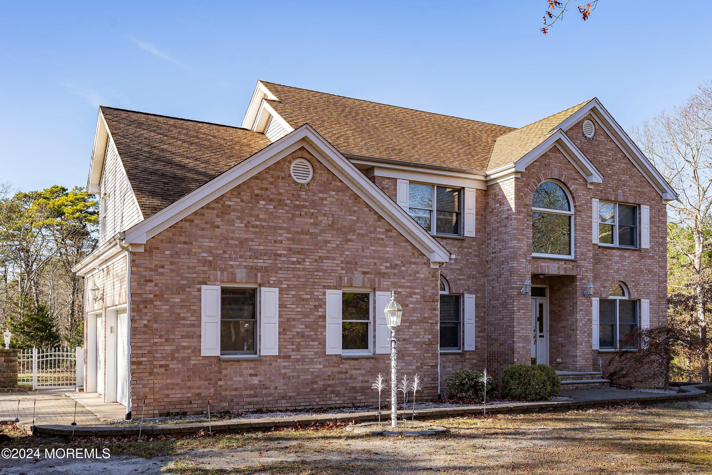 9 Ranch Boulevard Manahawkin, NJ 08050 - Photo 2 of 55 a front view of a house