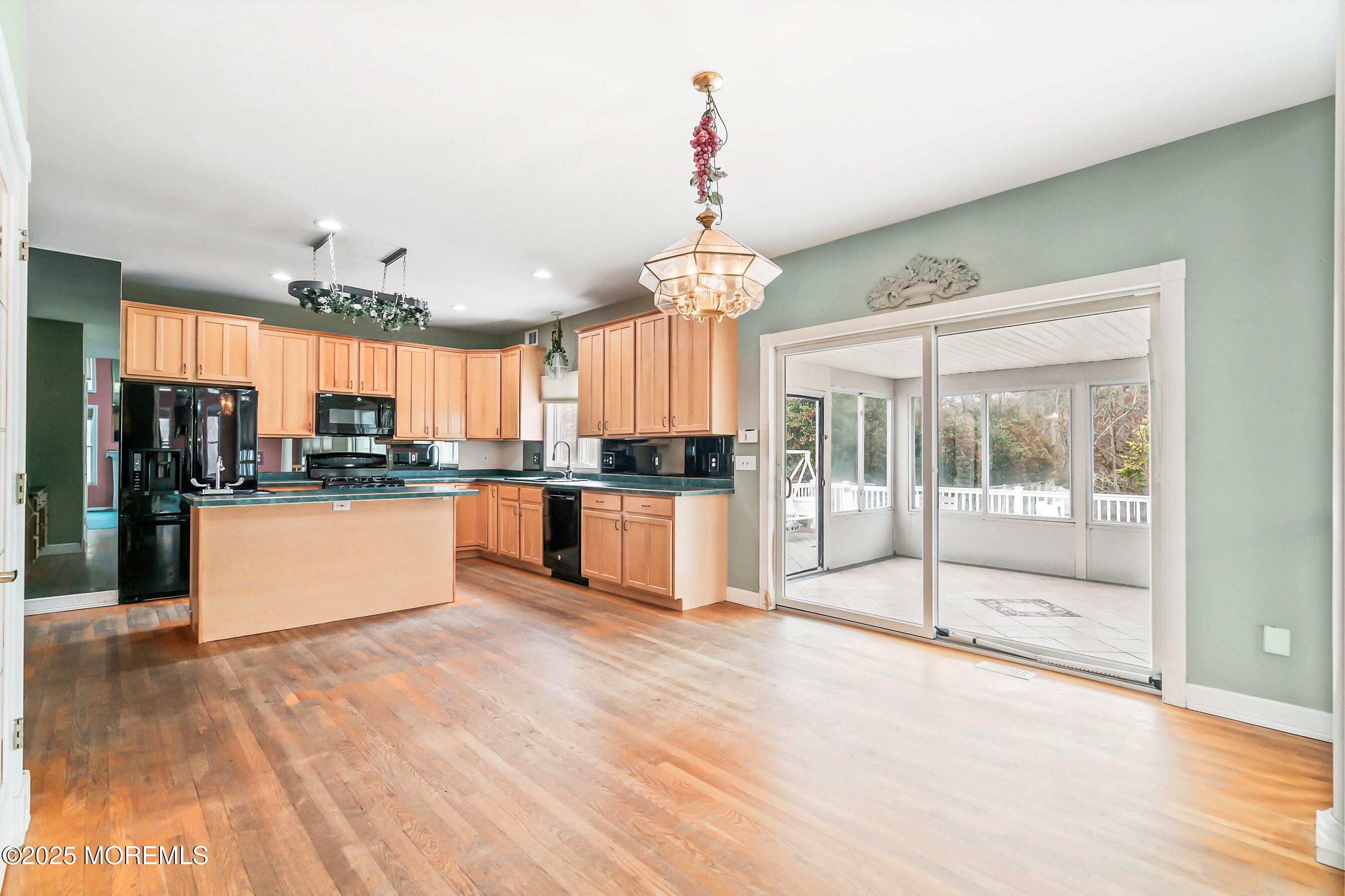 9 Ranch Boulevard Manahawkin, NJ 08050 - Photo 25 of 55 a large kitchen with granite countertop a stove and refrigerator