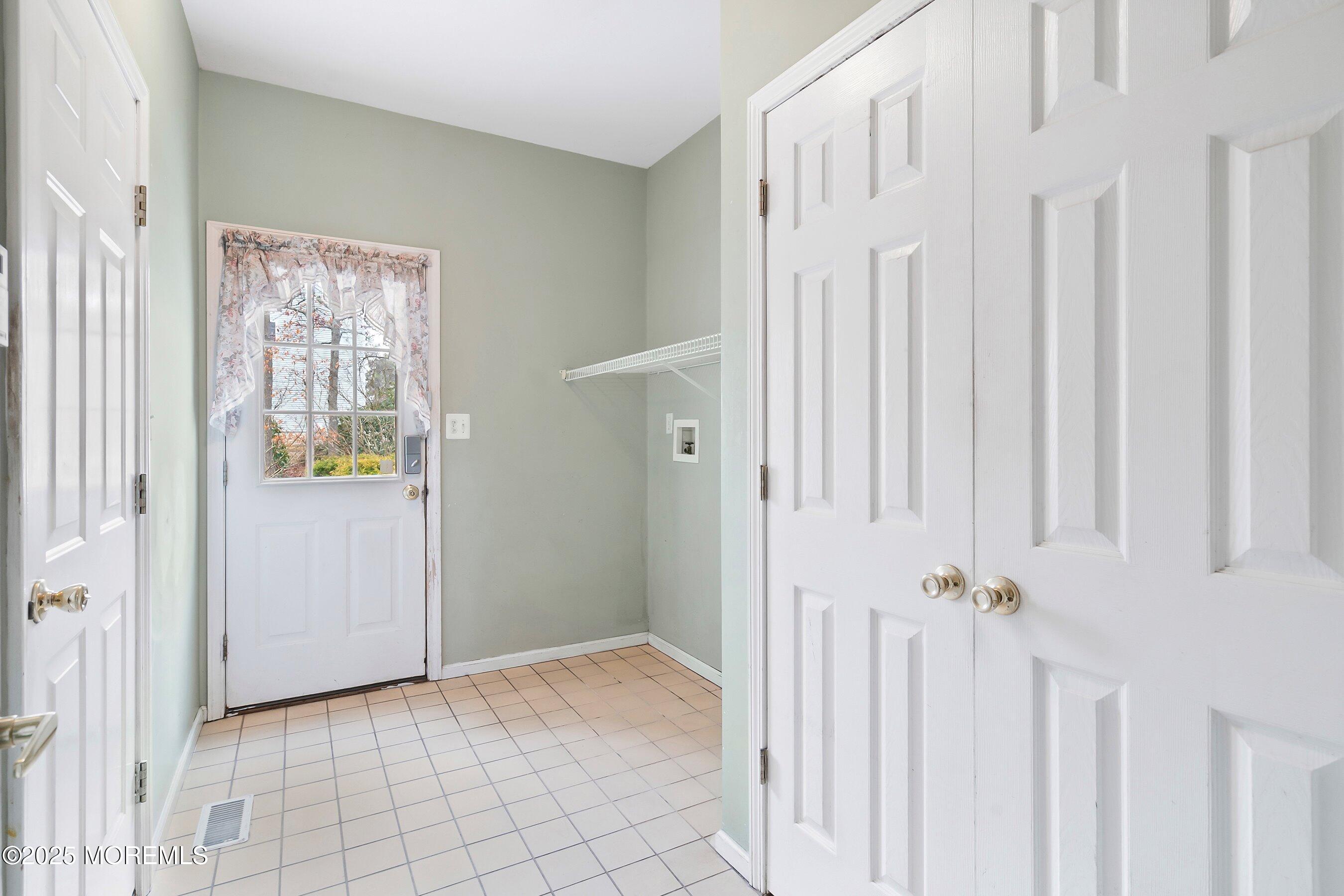 9 Ranch Boulevard Manahawkin, NJ 08050 - Photo 29 of 55 a view of an entryway with wooden floor