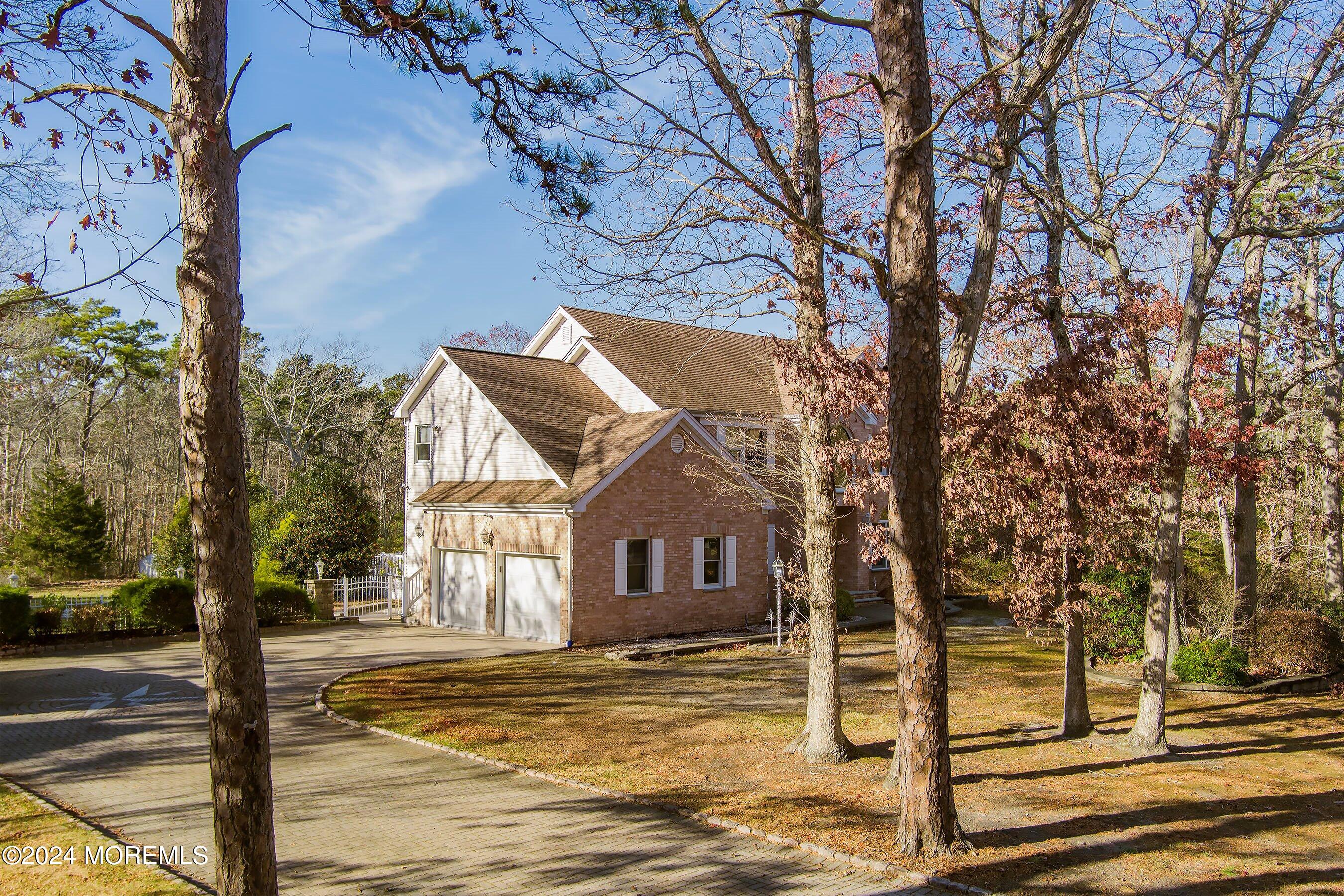 9 Ranch Boulevard Manahawkin, NJ 08050 - Photo 3 of 55 a front view of a house with a yard