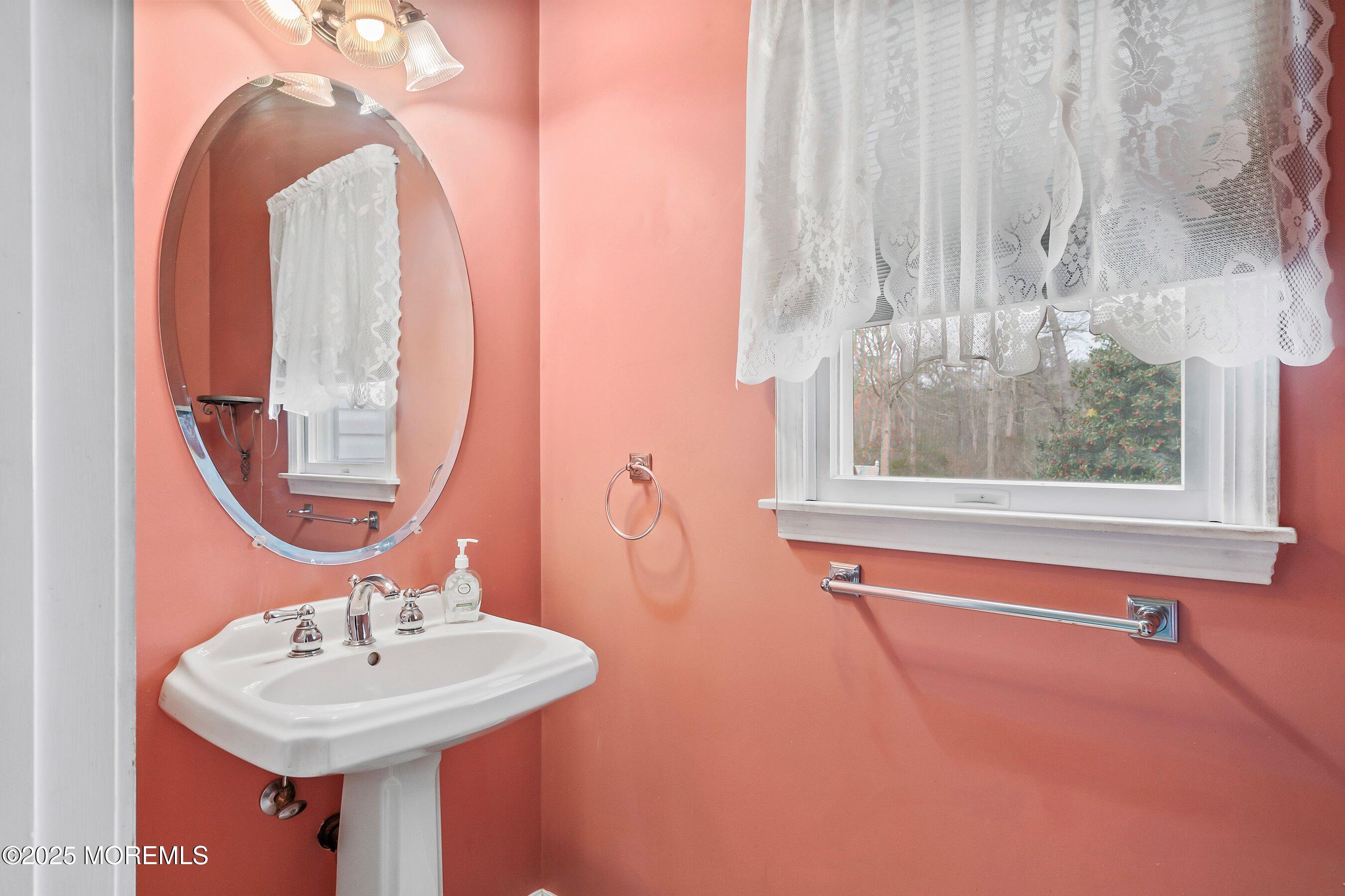 9 Ranch Boulevard Manahawkin, NJ 08050 - Photo 33 of 55 a bathroom with a sink and a mirror