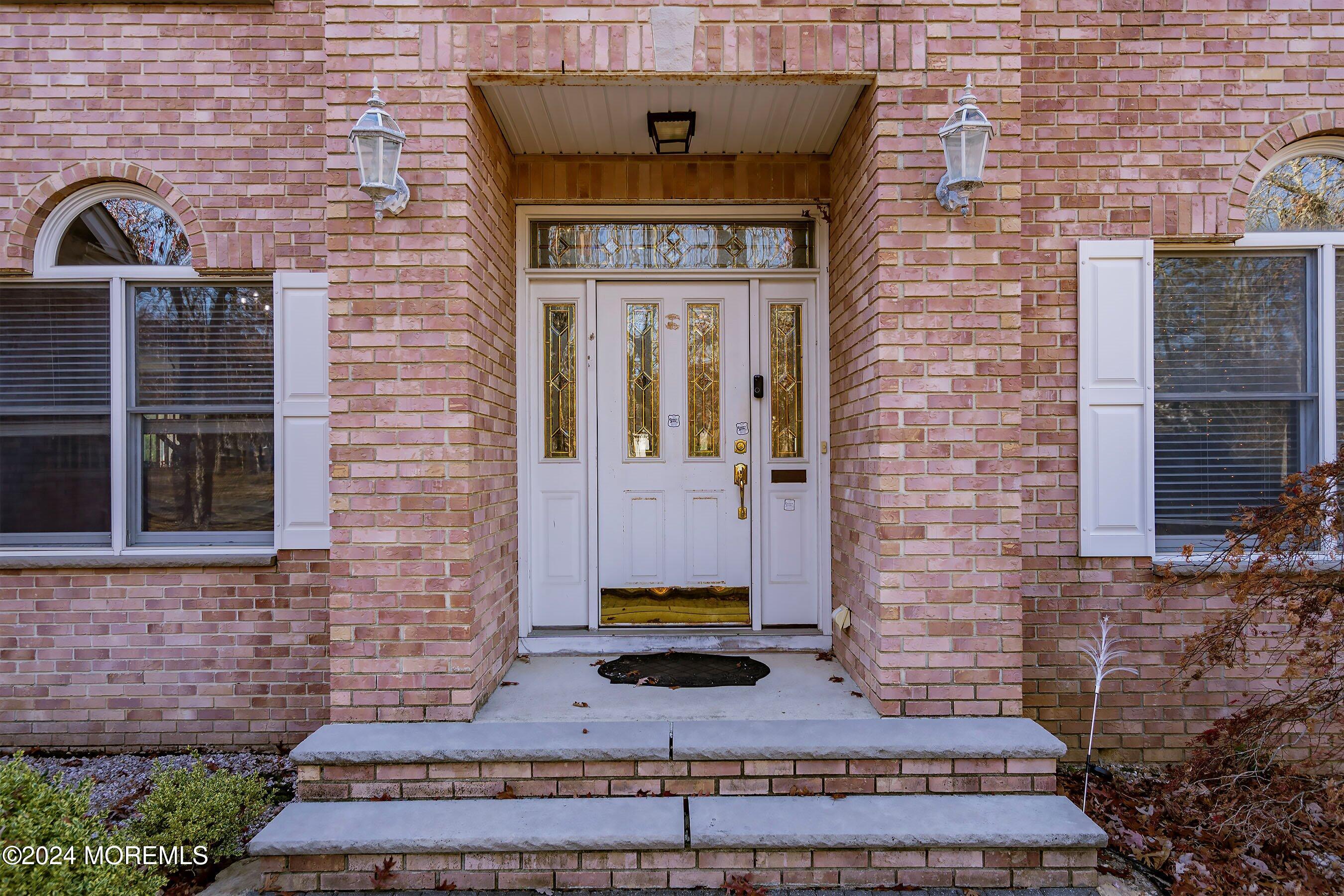 9 Ranch Boulevard Manahawkin, NJ 08050 - Photo 6 of 55 a view of a brick house with brick walls