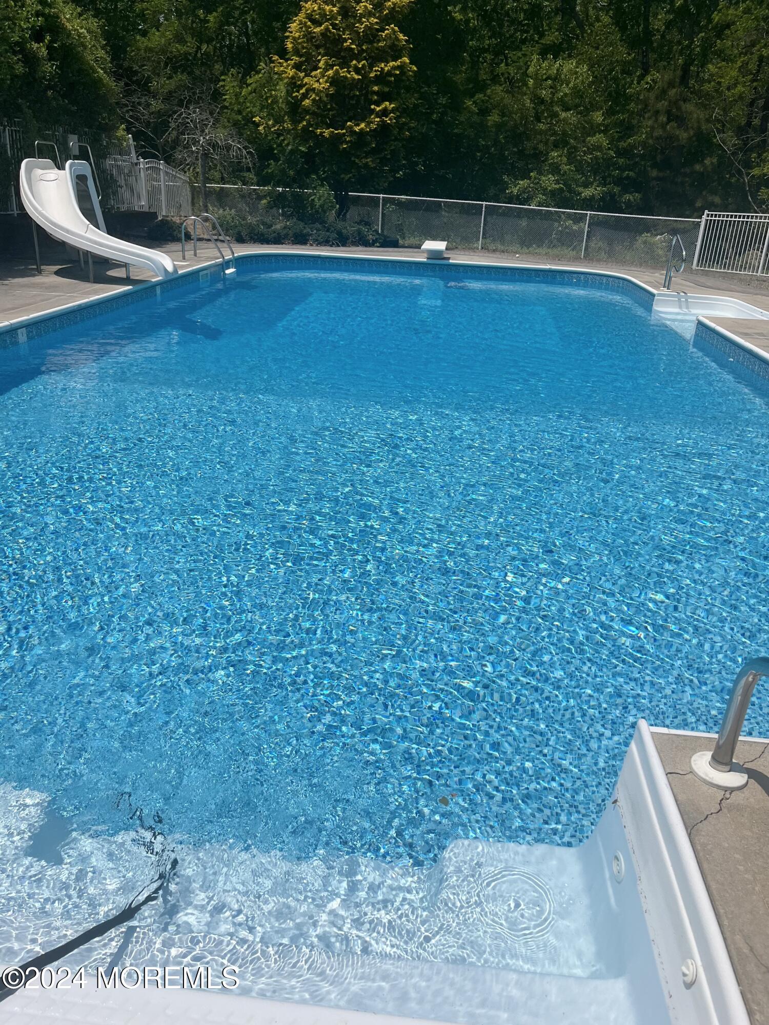 9 Ranch Boulevard Manahawkin, NJ 08050 - Photo 9 of 55 a view of a swimming pool with an outdoor space and seating area
