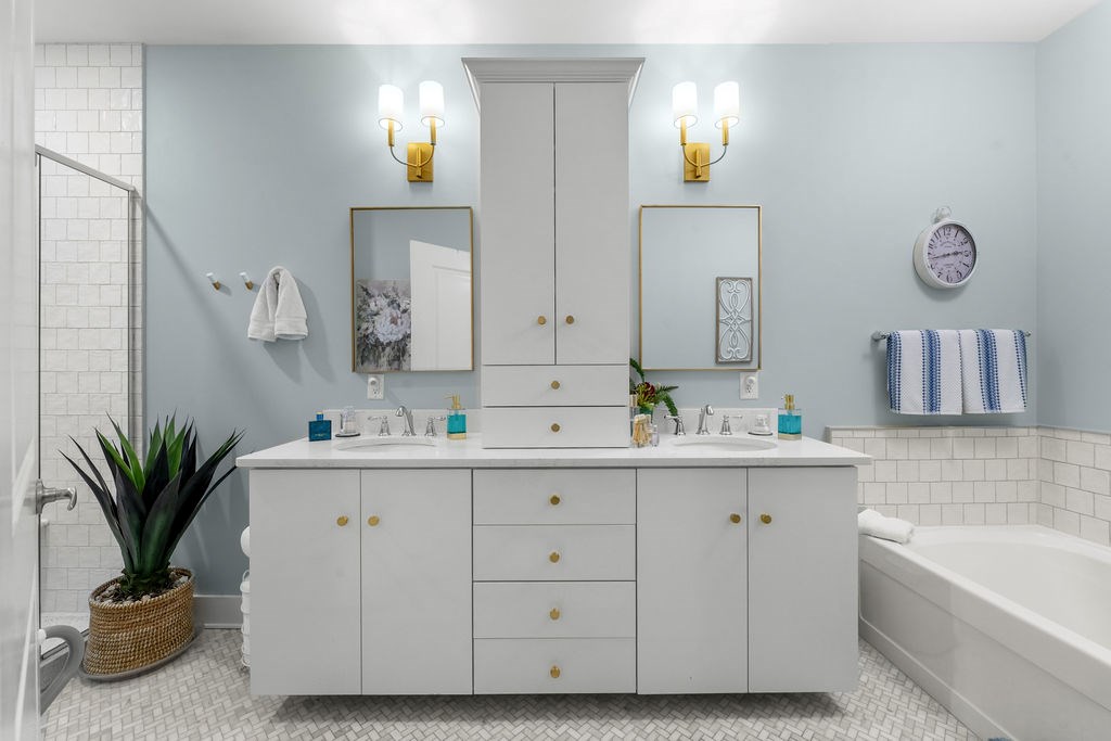 1201 Front Avenue, Unit 322 Columbus, GA 31901 - Photo 37 of 54 a bathroom with a double vanity sink and a mirror