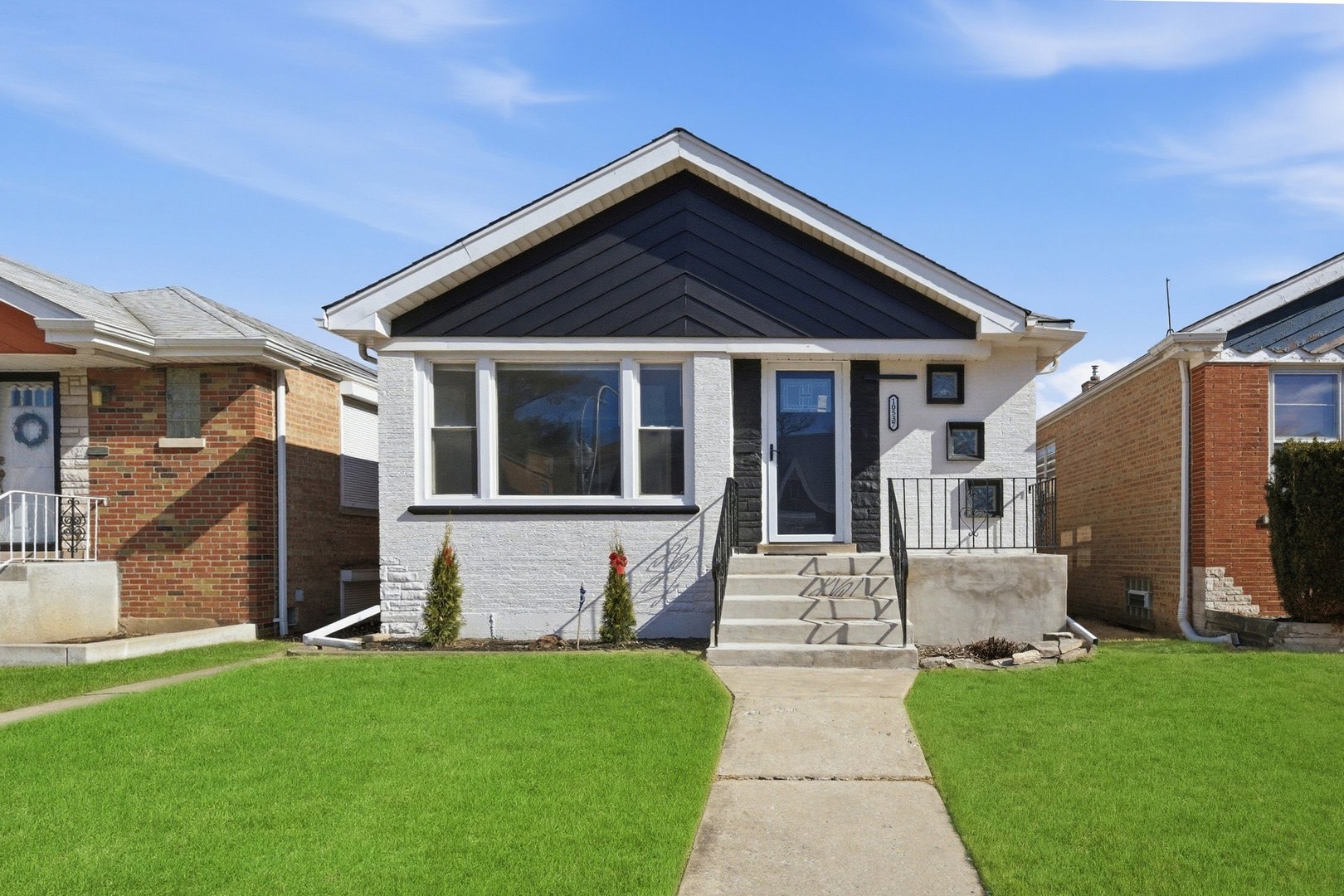10537 South Rhodes Avenue Chicago, IL 60628 - Photo 1 of 1 a front view of a house with a yard