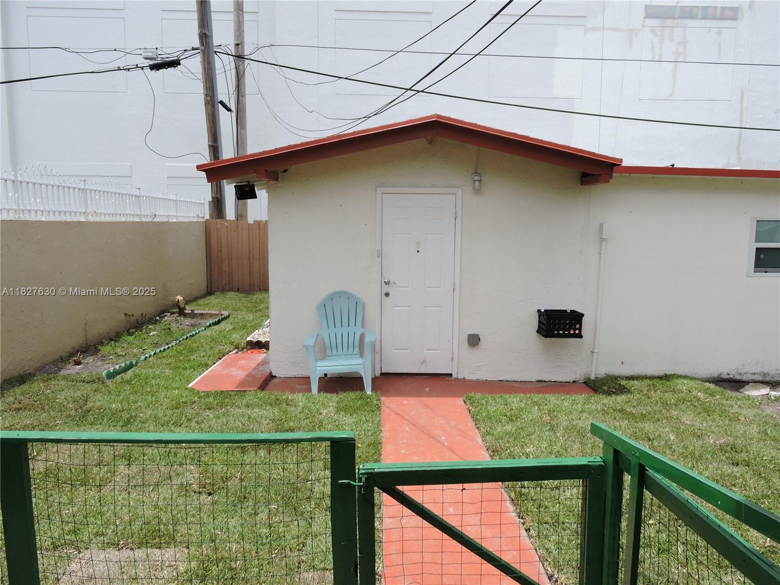 525 East 24th Street, Unit 4 Hialeah, FL 33013 - Photo 1 of 17 a front view of a house with yard