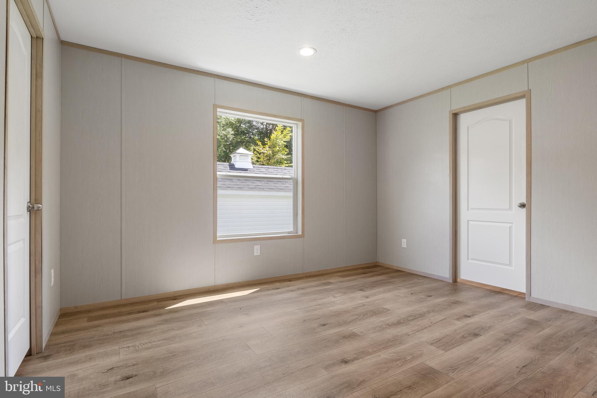 31 Mill Street York, PA 17406 - Photo 13 of 19 a view of an empty room with wooden floor and a window