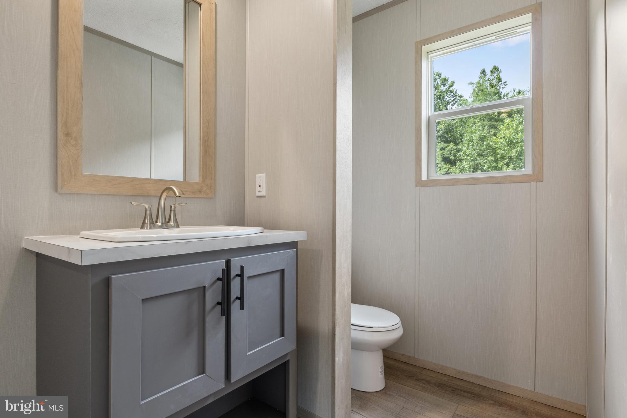 31 Mill Street York, PA 17406 - Photo 16 of 19 a spacious bathroom with a toilet sink and mirror
