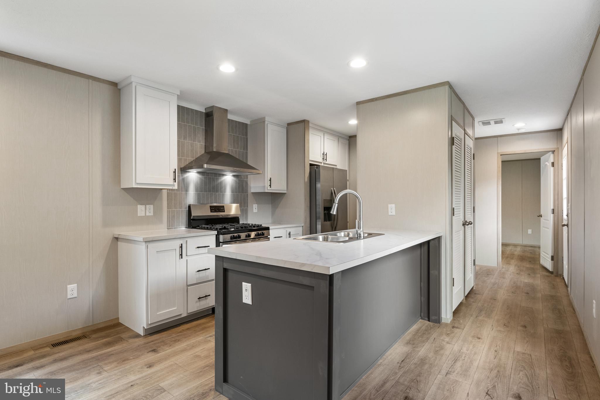 31 Mill Street York, PA 17406 - Photo 3 of 19 a kitchen with stainless steel appliances a sink stove and refrigerator