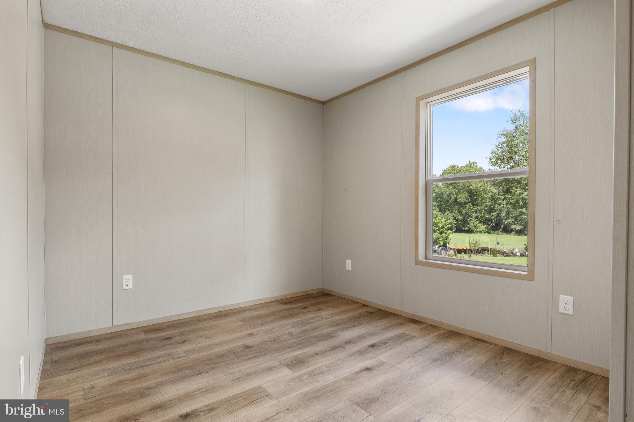 31 Mill Street York, PA 17406 - Photo 9 of 19 a view of an empty room with wooden floor and a window