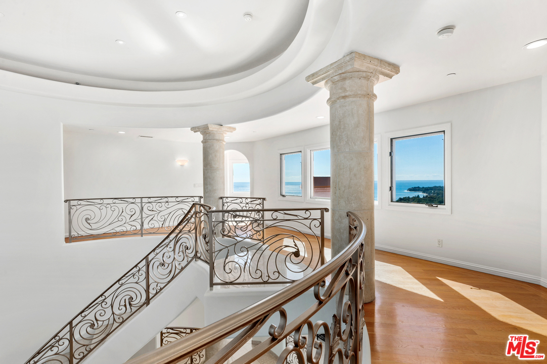 27445 Winding Way Malibu, CA 90265 - Photo 22 of 51 a view of a balcony and wooden floor