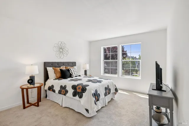 a bathroom with a sink toilet vanity and shower