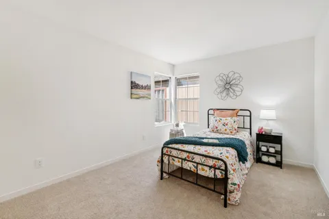 a bedroom with a bed and a cabinets