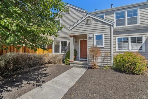 front view of a house with a bench