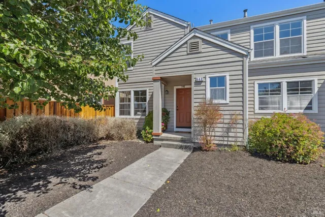 front view of a house with a bench