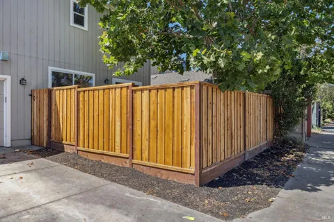 a view of backyard with tub and trees