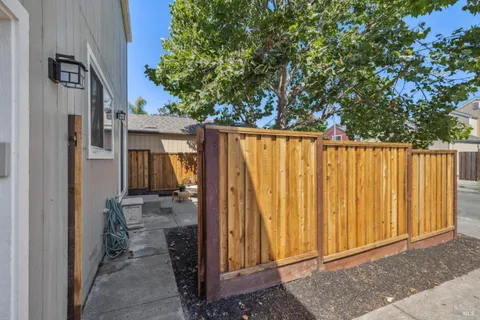 a view of a house with a backyard space