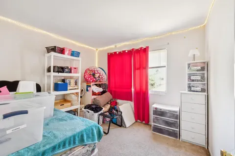 a bedroom with furniture and a bed