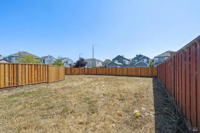 a view of a pathway with a backyard
