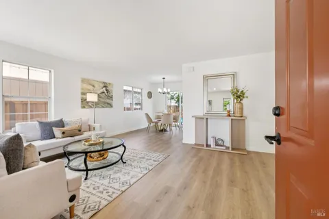a living room with furniture and a table