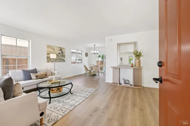 a living room with furniture and a table