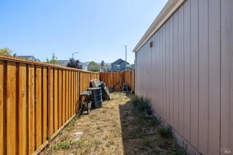 a view of a pathway with a backyard