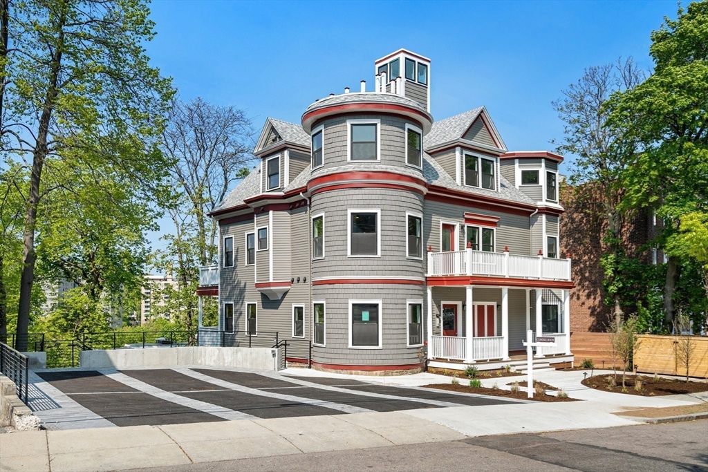 111 Winthrop Road, Unit 2 Brookline, MA 02445 - Photo 2 of 12 a front view of a house with a yard