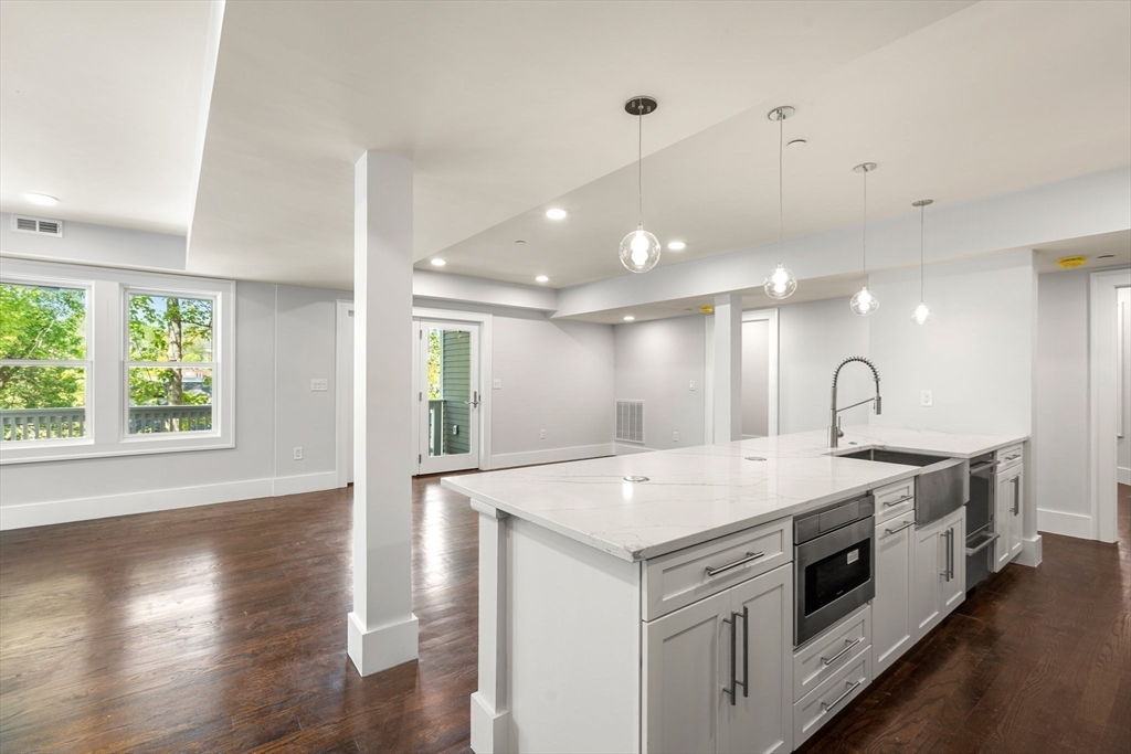 111 Winthrop Road, Unit 2 Brookline, MA 02445 - Photo 4 of 12 a kitchen with a sink and a stove