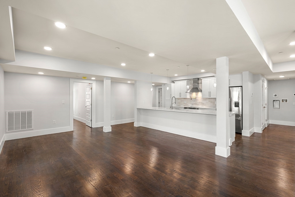 111 Winthrop Road, Unit 2 Brookline, MA 02445 - Photo 5 of 12 a view of kitchen with refrigerator and wooden floor