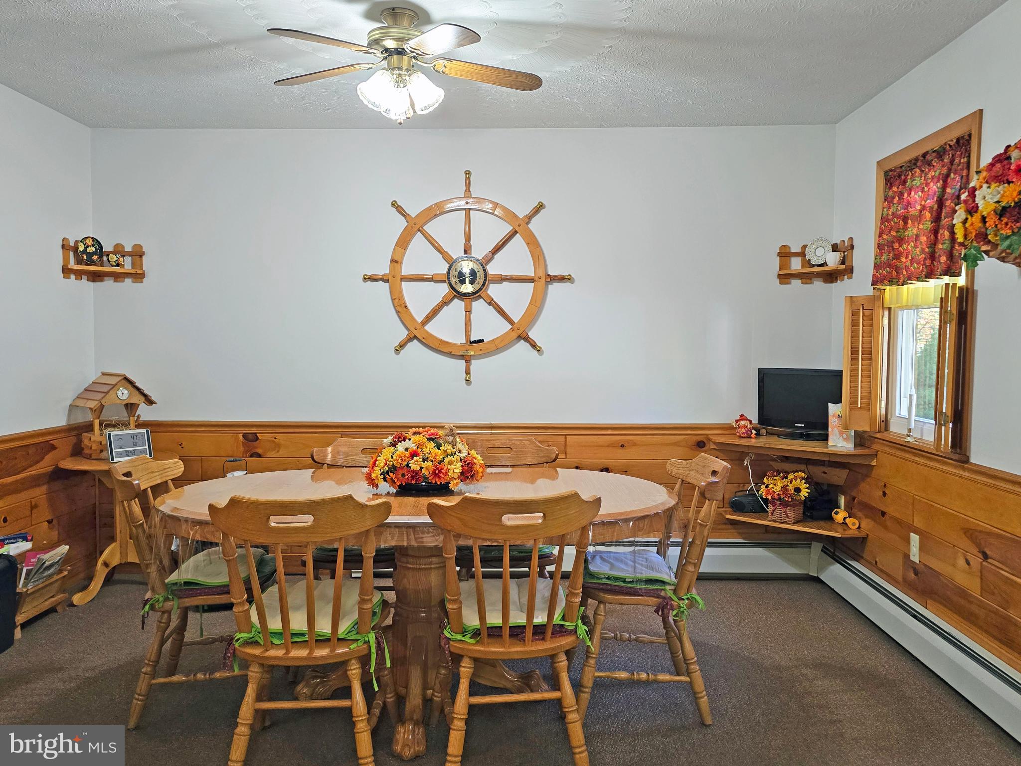 162 Avilton Road Lonaconing, MD 21539 - Photo 11 of 49 a view of a dining room with furniture and a chandelier