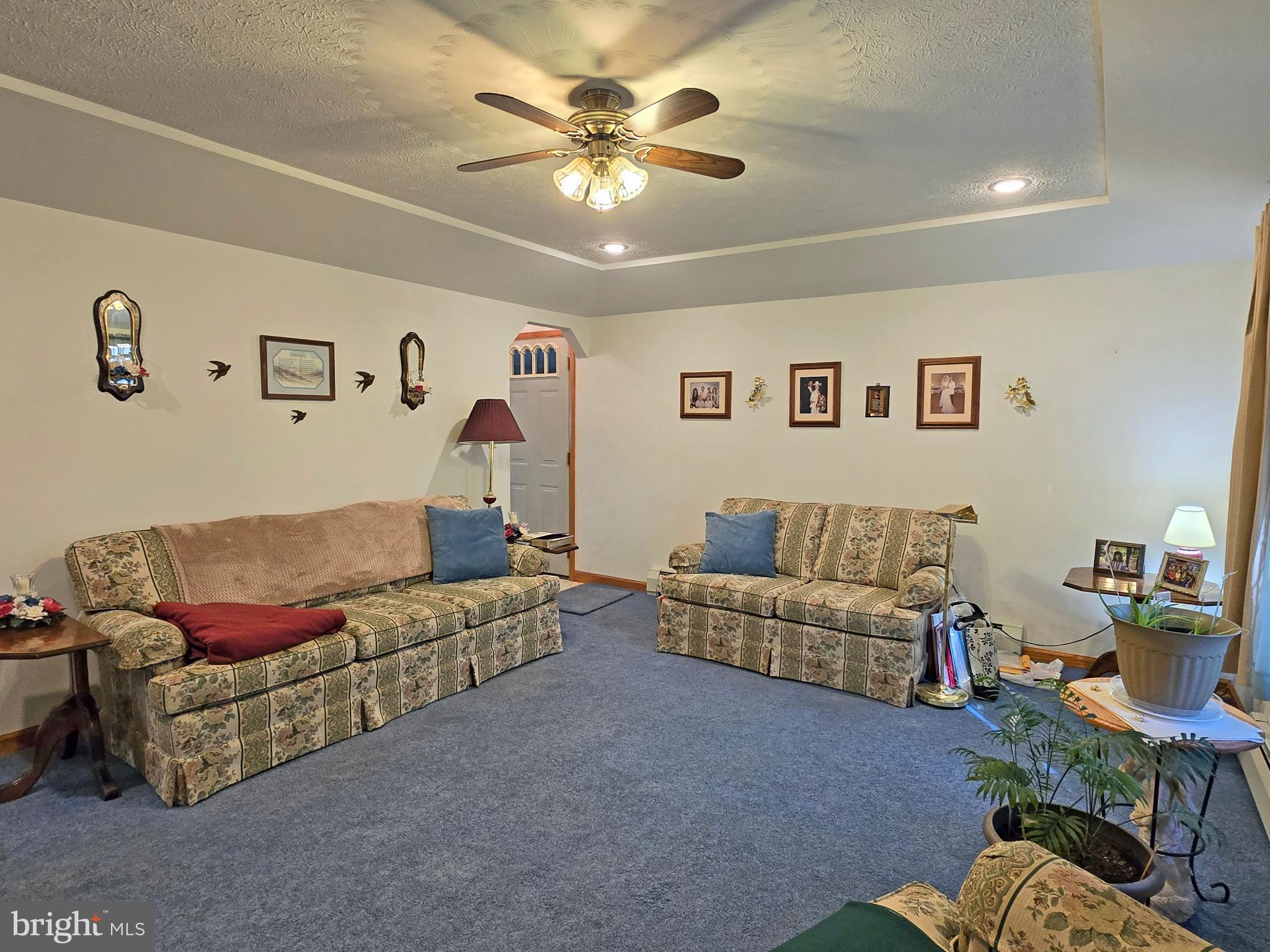 162 Avilton Road Lonaconing, MD 21539 - Photo 13 of 49 a living room with furniture and a chandelier