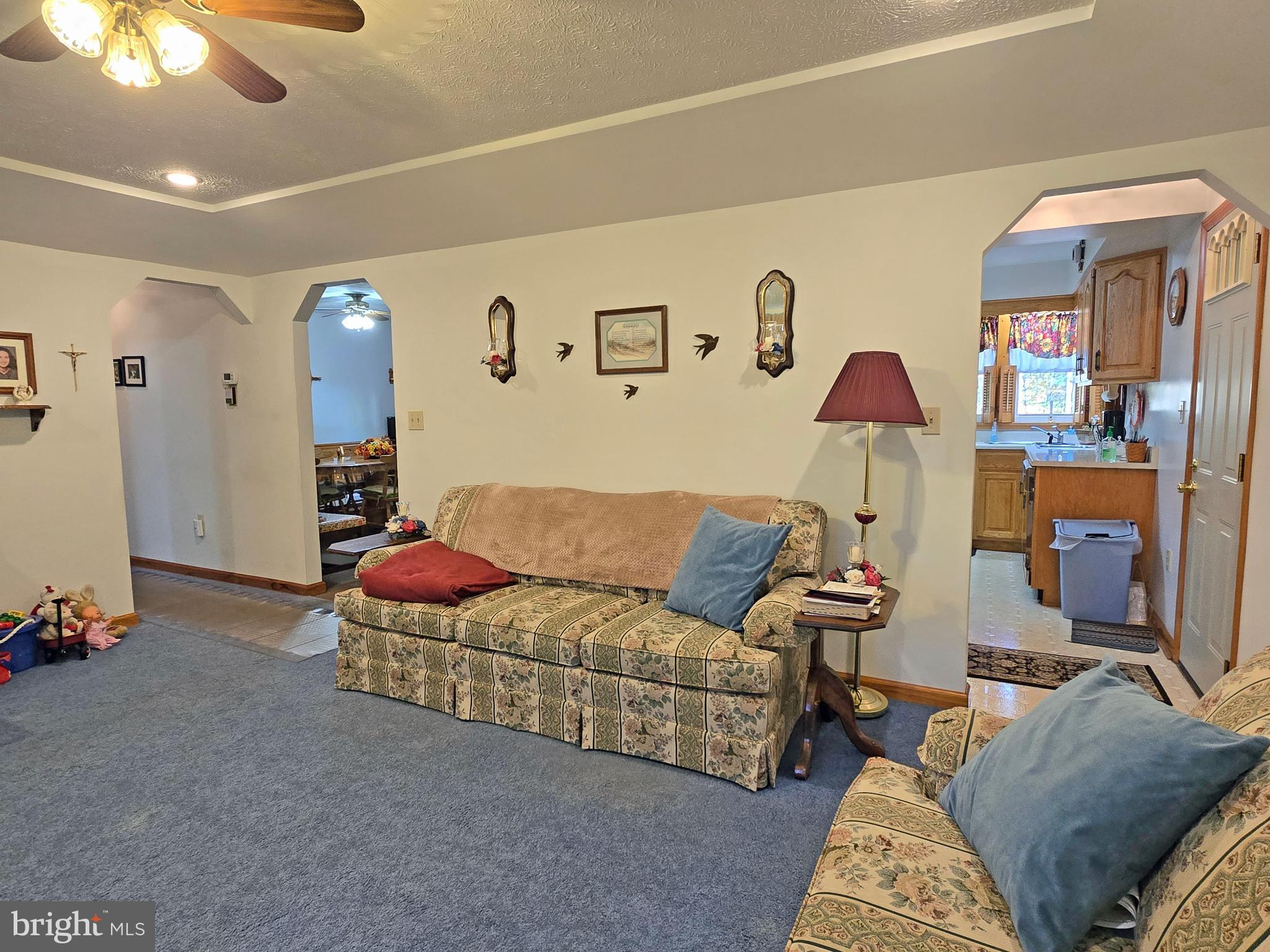 162 Avilton Road Lonaconing, MD 21539 - Photo 14 of 49 a living room with furniture and a window