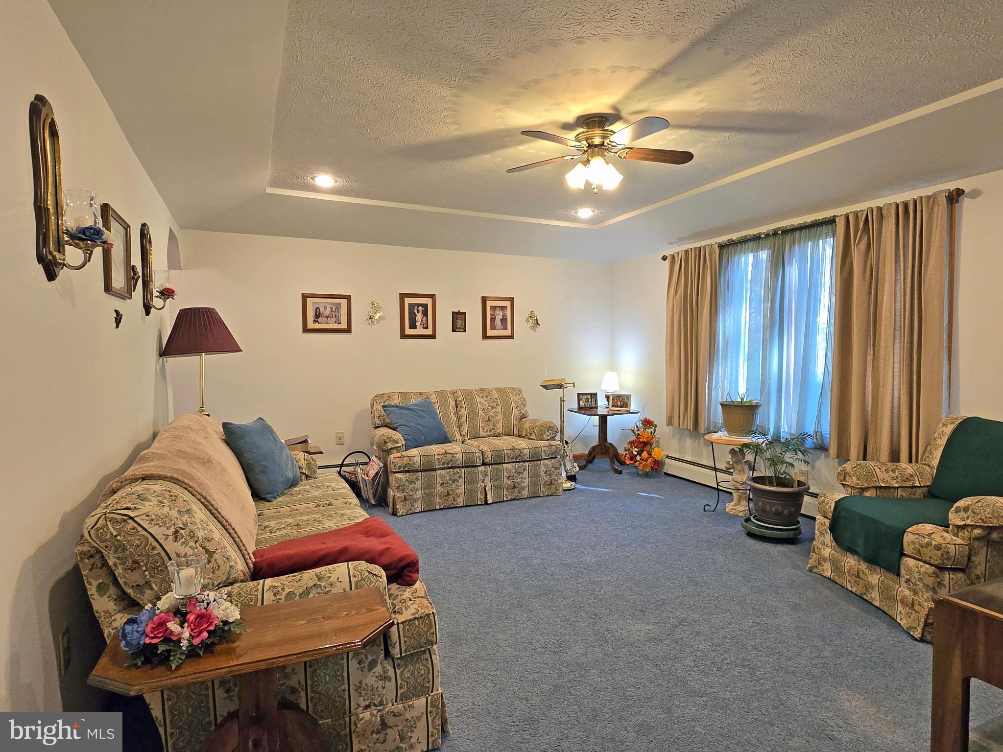 162 Avilton Road Lonaconing, MD 21539 - Photo 15 of 49 a living room with furniture and a chandelier
