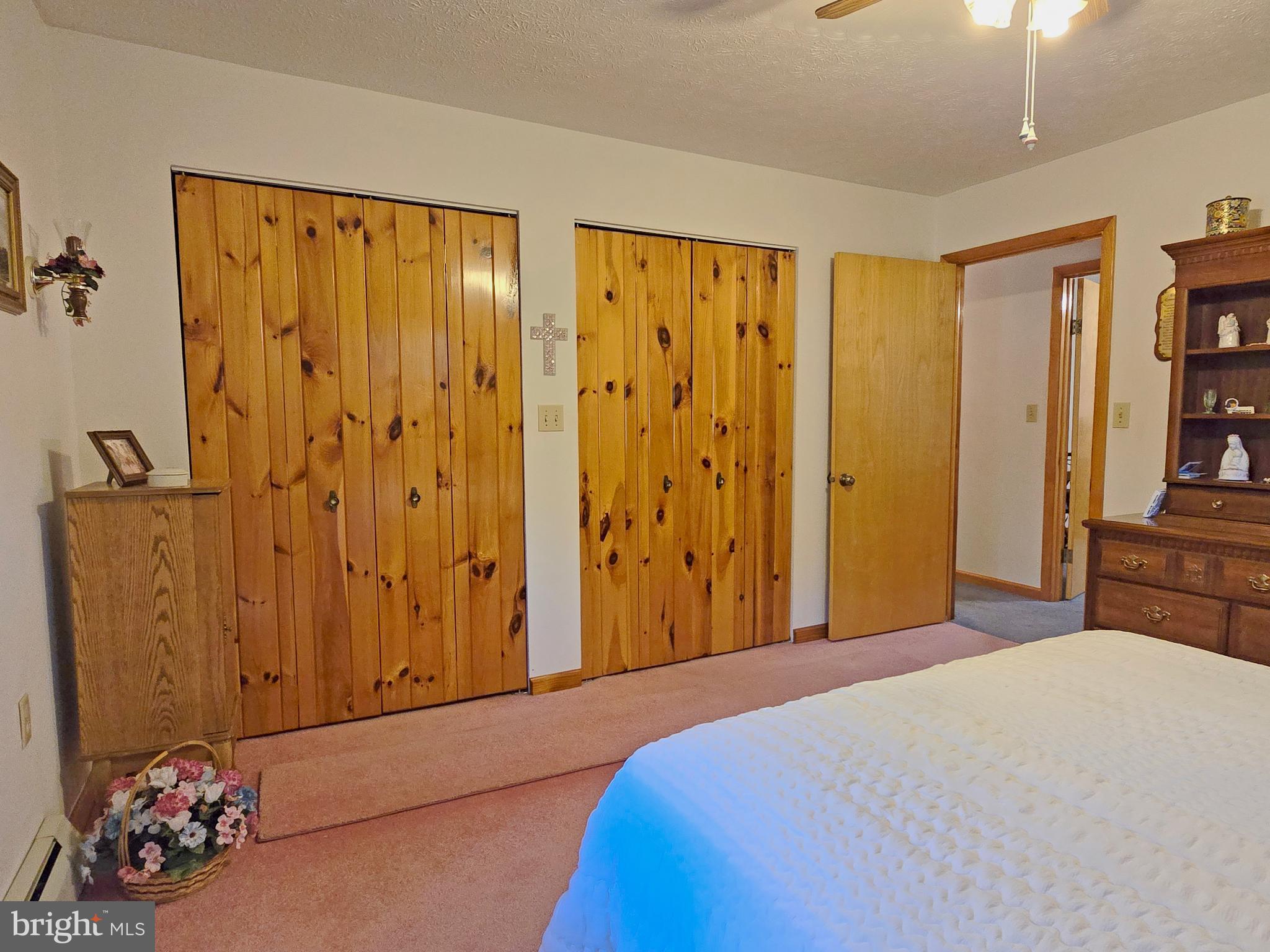 162 Avilton Road Lonaconing, MD 21539 - Photo 17 of 49 a bedroom with a bed and book shelf