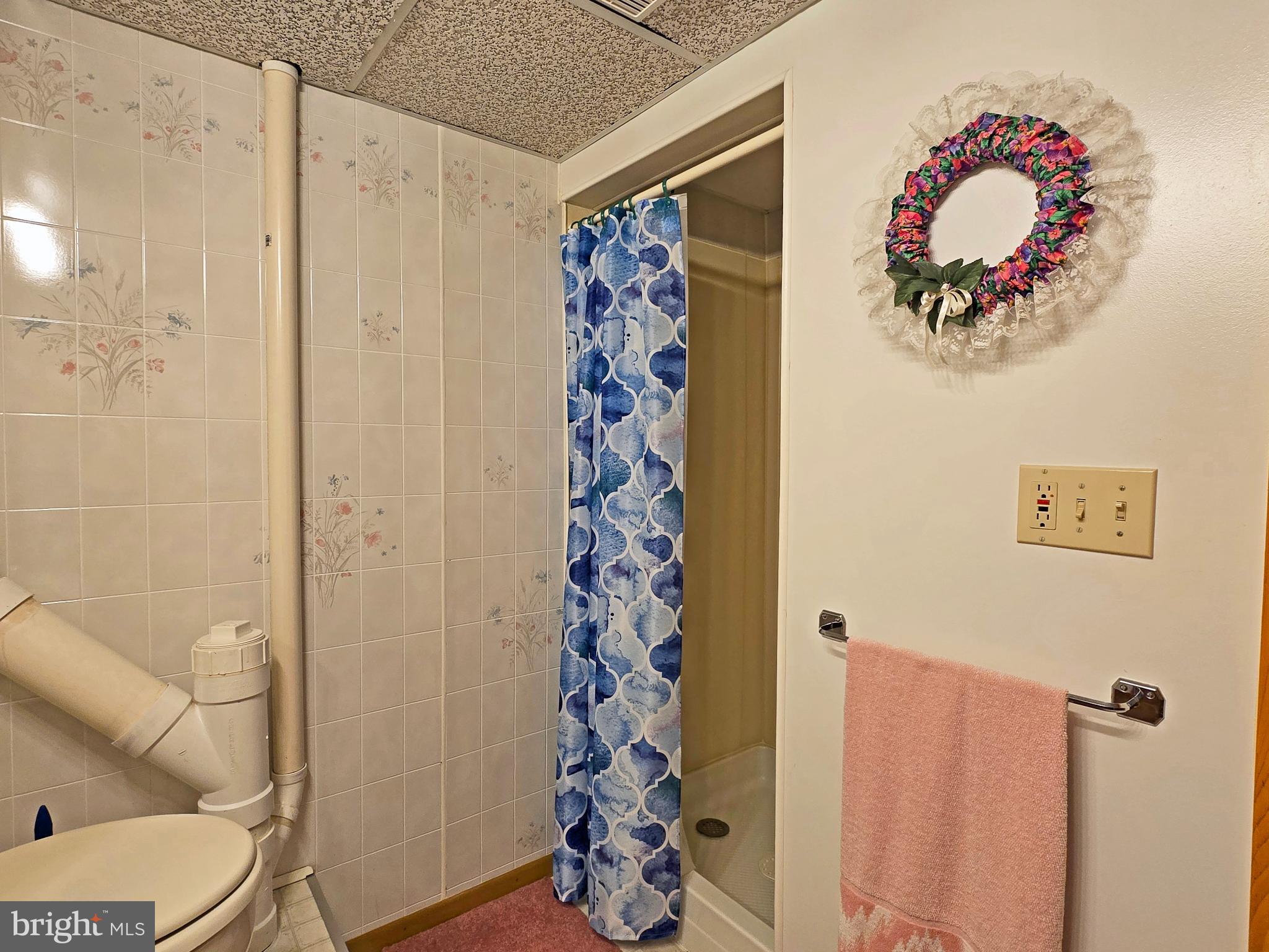 162 Avilton Road Lonaconing, MD 21539 - Photo 36 of 49 a bathroom with a sink toilet and shower