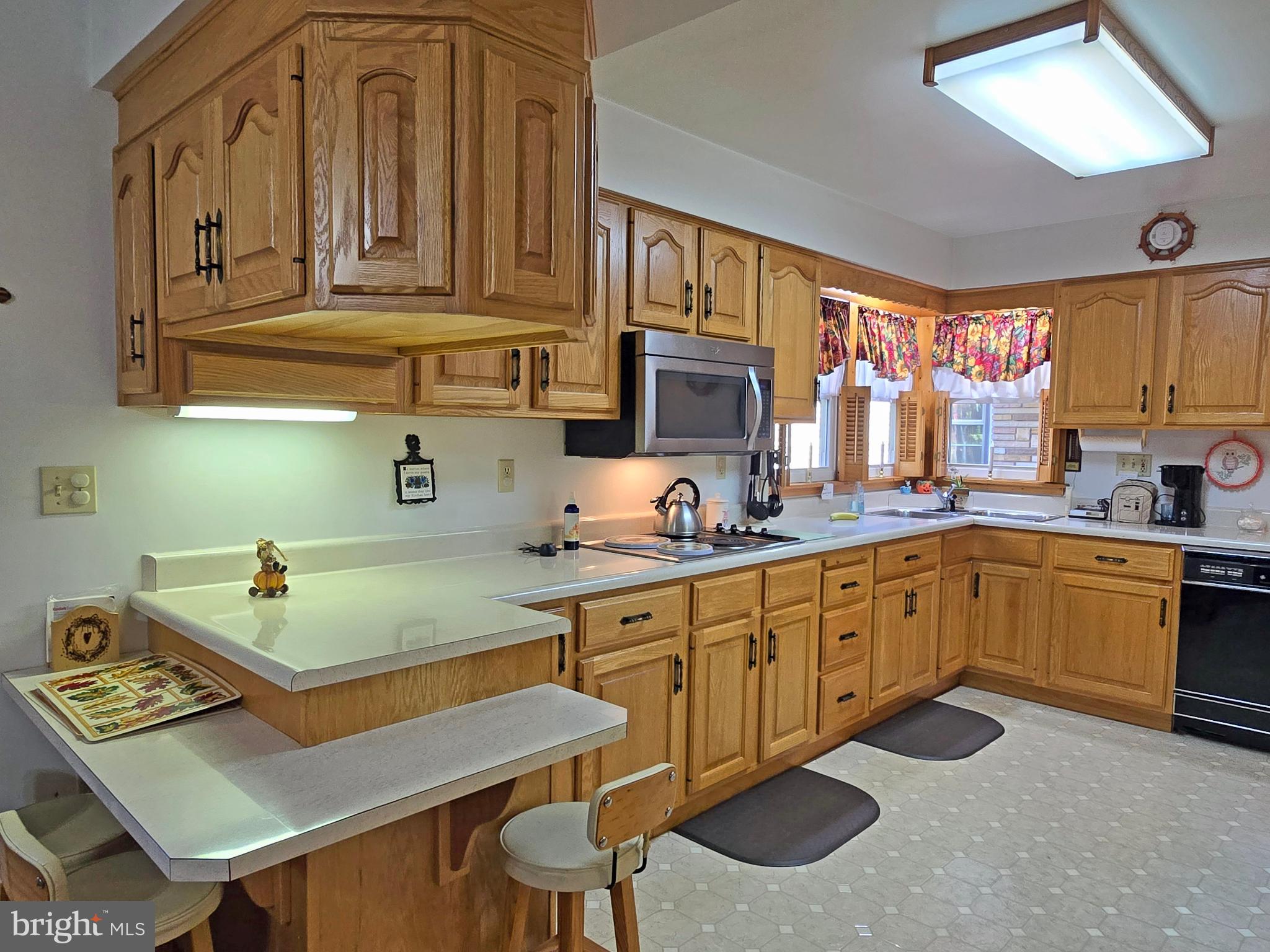 162 Avilton Road Lonaconing, MD 21539 - Photo 4 of 49 a kitchen with a cabinets and appliances
