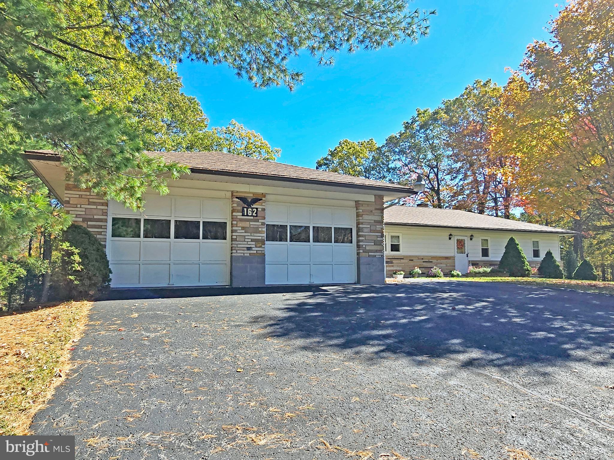 162 Avilton Road Lonaconing, MD 21539 - Photo 46 of 49 a front view of a house with a garden