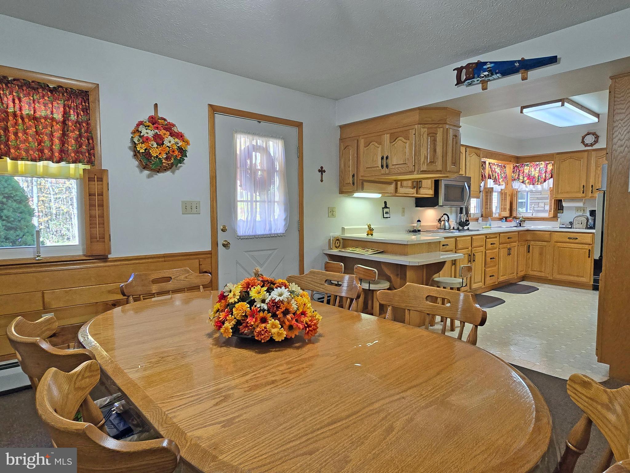 162 Avilton Road Lonaconing, MD 21539 - Photo 10 of 49 a room with a table chairs and window