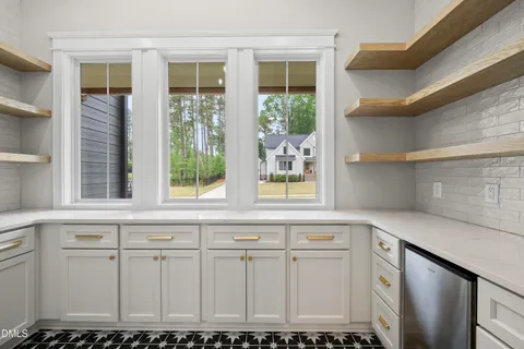 a kitchen with a cabinets and a stove