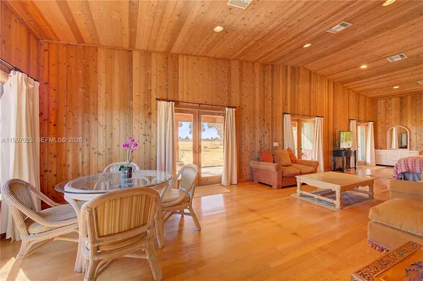 a view of balcony with wooden floor